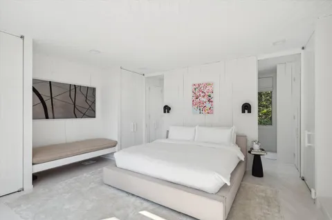 a bathroom with a sink a mirror and a shower