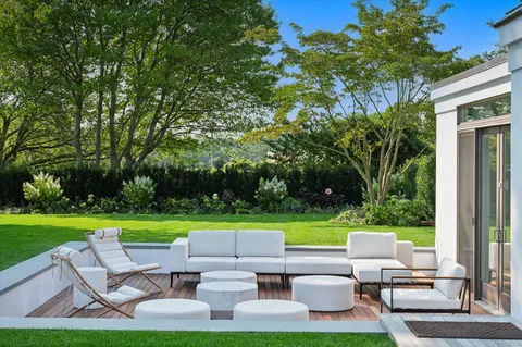 a view of a patio with furniture