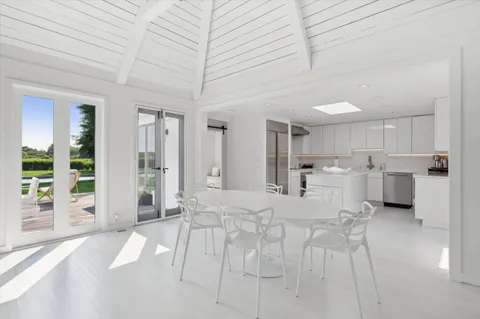 a large white bed in a white room