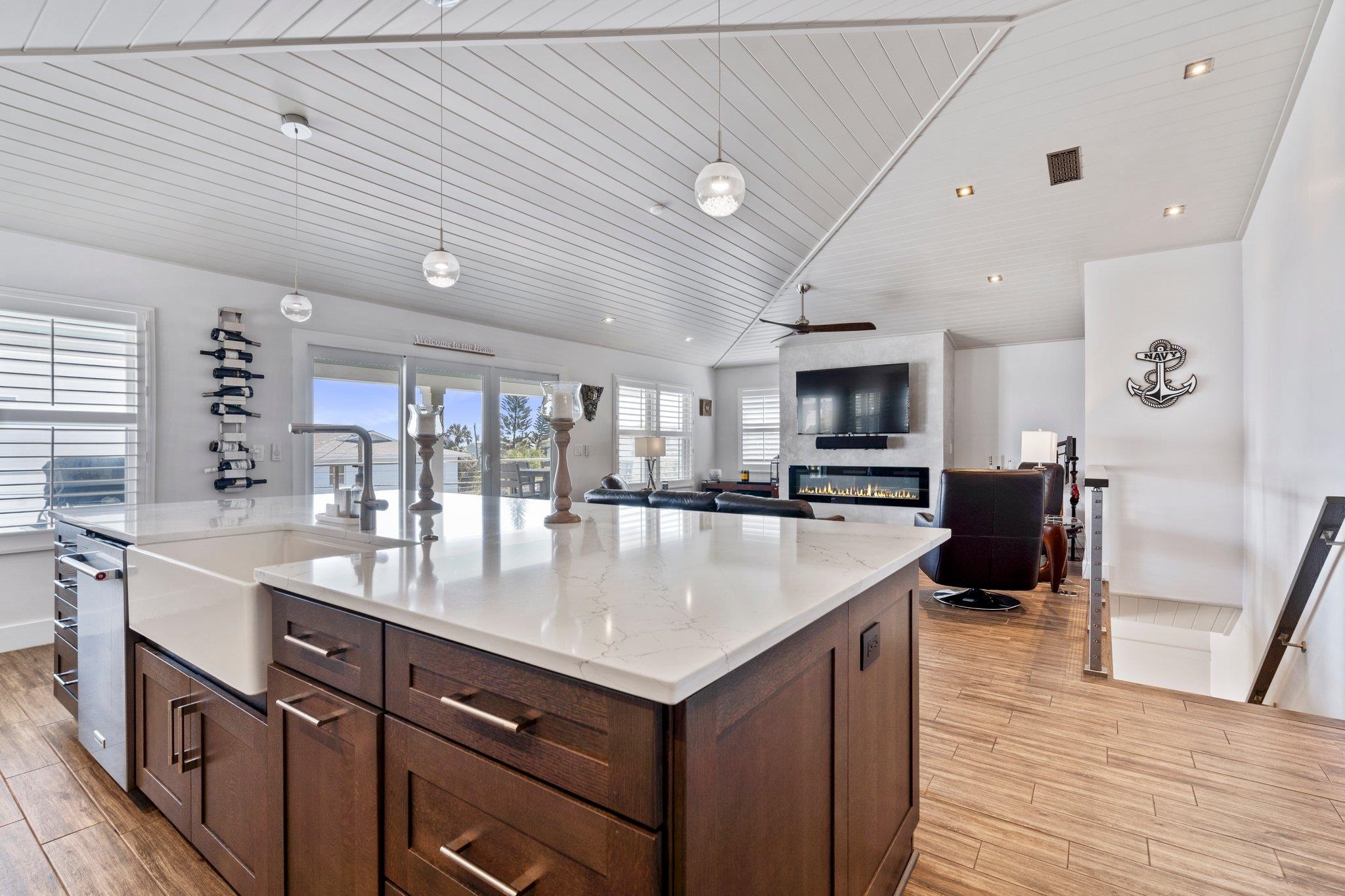 5497 Pelican Way St. Augustine, FL 32080 - Photo 11 of 49 a large kitchen with kitchen island a sink a counter space and stainless steel appliances