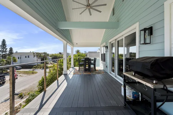 a view of a patio with a table and chairs