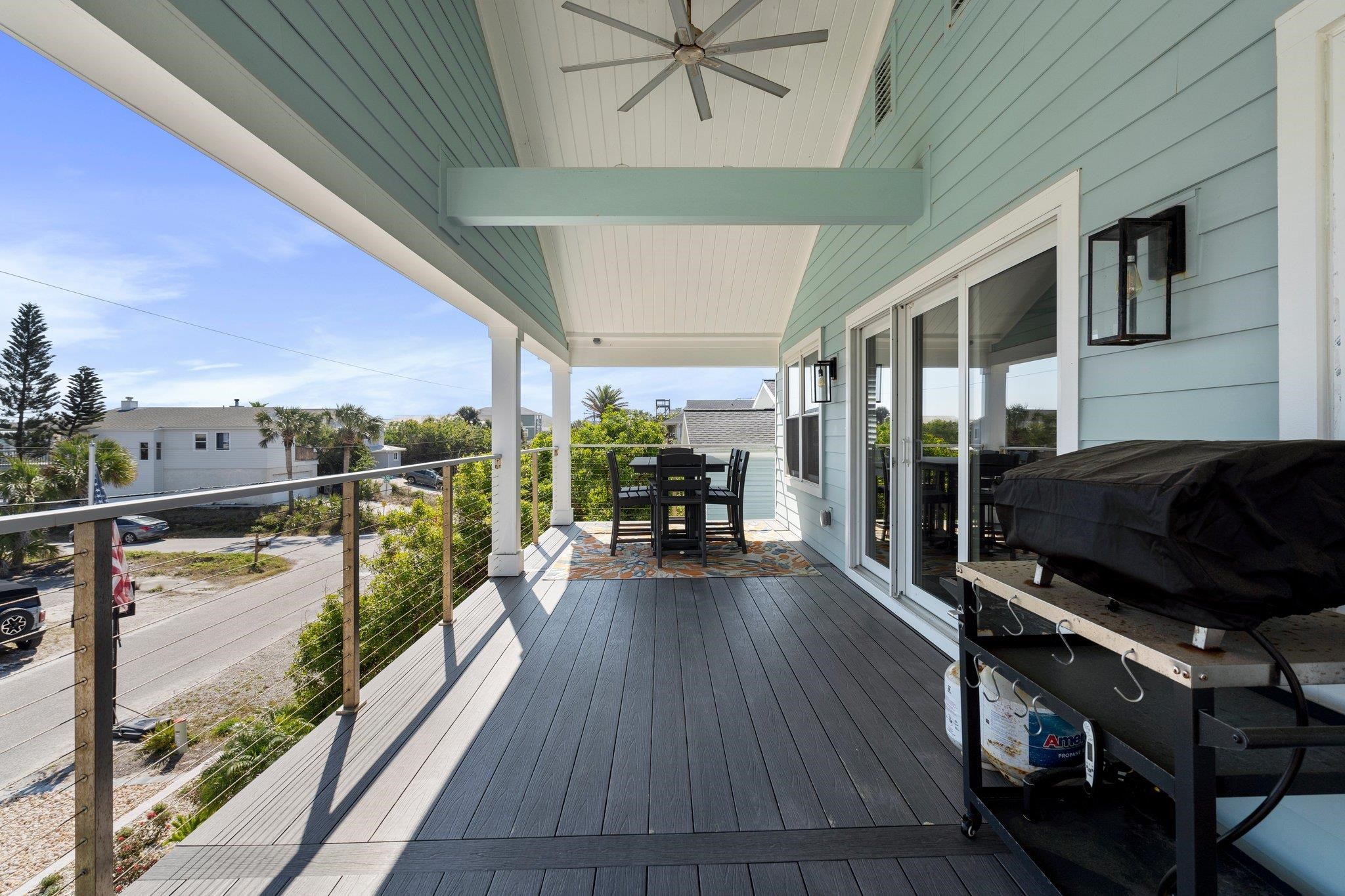5497 Pelican Way St. Augustine, FL 32080 - Photo 20 of 49 a view of a balcony with couch and wooden floor