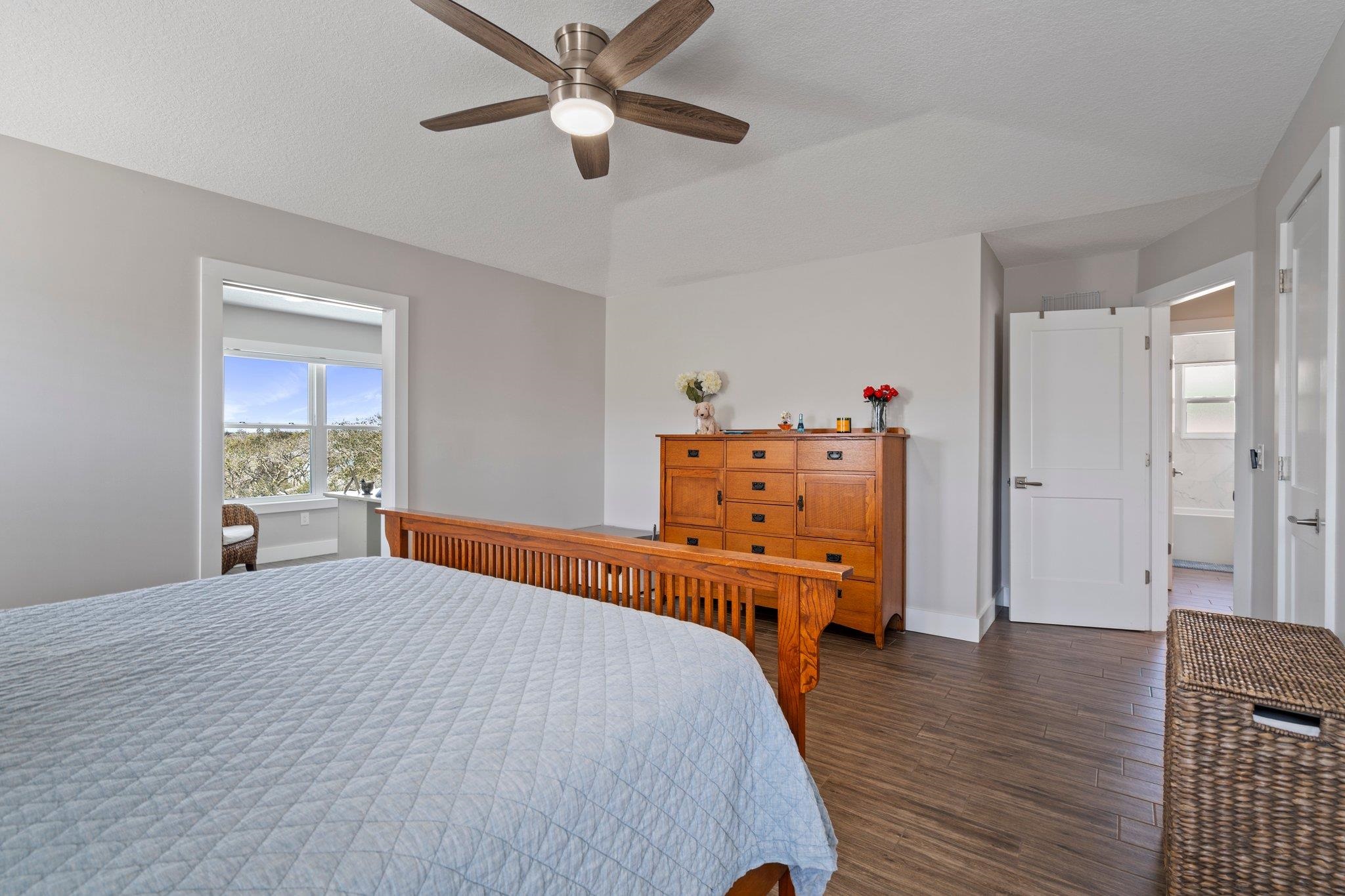5497 Pelican Way St. Augustine, FL 32080 - Photo 23 of 49 a bedroom with a bed and wooden floor