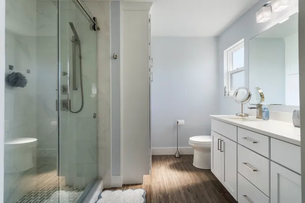 a bathroom with a sink double vanity and a mirror