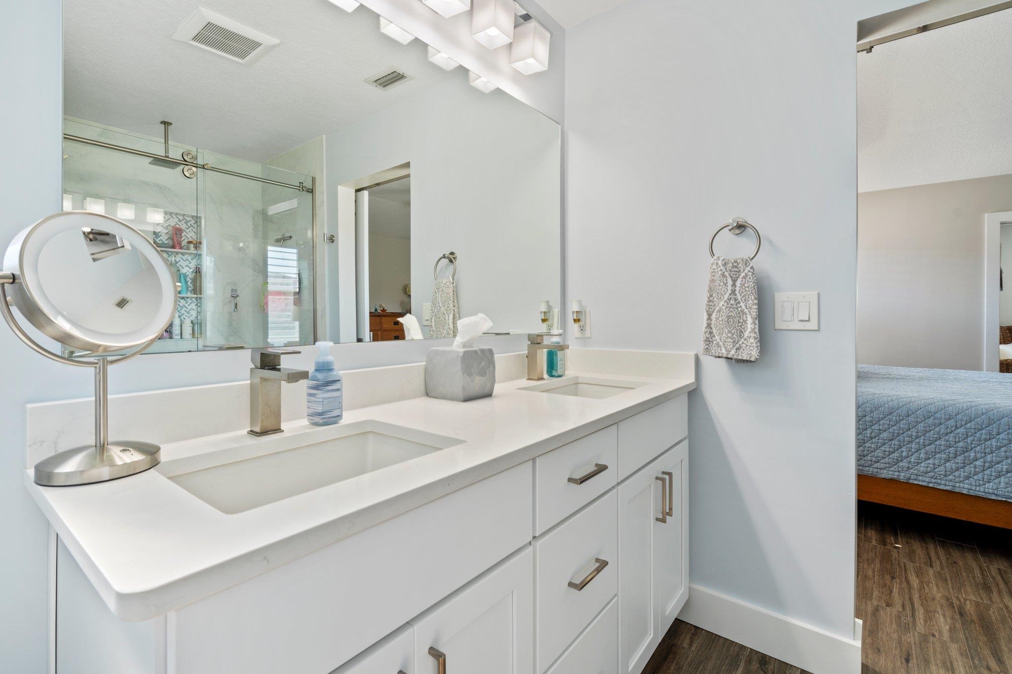 5497 Pelican Way St. Augustine, FL 32080 - Photo 25 of 49 a bathroom with a sink double vanity and a mirror