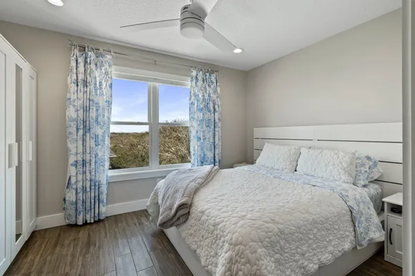 a bedroom with a bed and a television