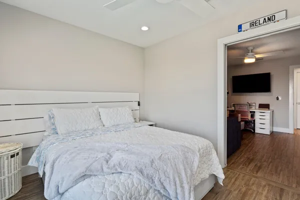 a view of a livingroom with furniture and a flat screen tv