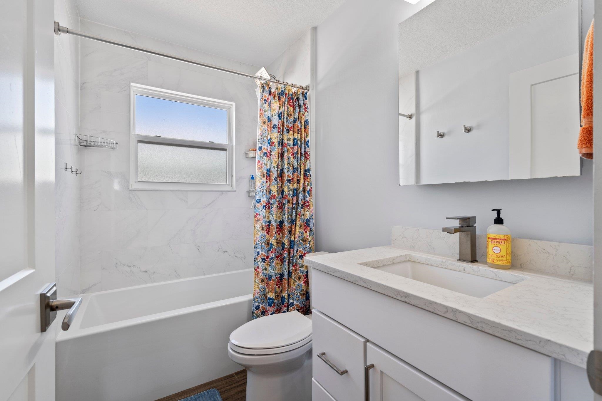 5497 Pelican Way St. Augustine, FL 32080 - Photo 32 of 49 a bathroom with a sink a toilet and shower