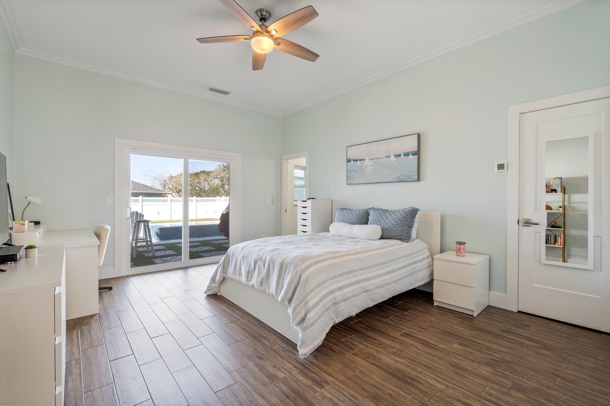 5497 Pelican Way St. Augustine, FL 32080 - Photo 33 of 49 a bedroom with a large bed and a window