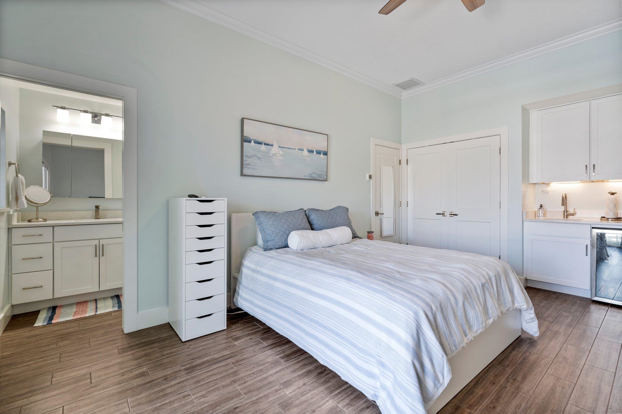 5497 Pelican Way St. Augustine, FL 32080 - Photo 34 of 49 a bedroom with a bed and a cabinets