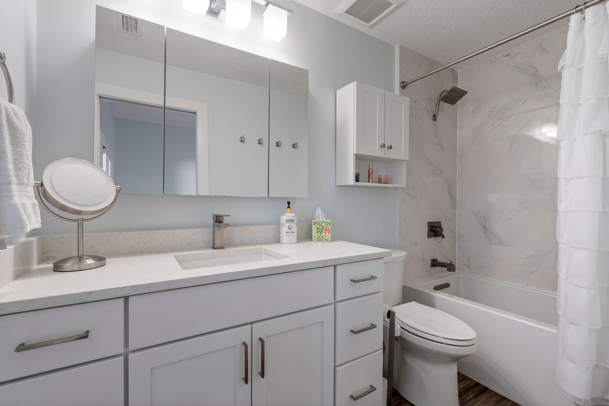 5497 Pelican Way St. Augustine, FL 32080 - Photo 36 of 49 a bathroom with a sink toilet and shower
