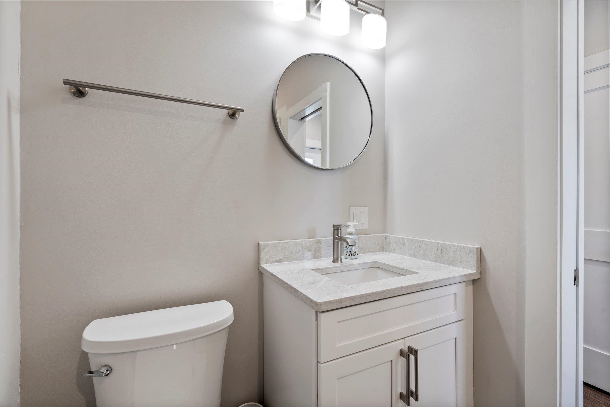5497 Pelican Way St. Augustine, FL 32080 - Photo 40 of 49 a bathroom with a sink a toilet and a mirror