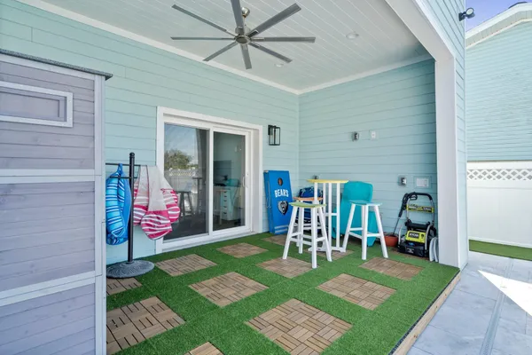 a view of a house with backyard porch and patio
