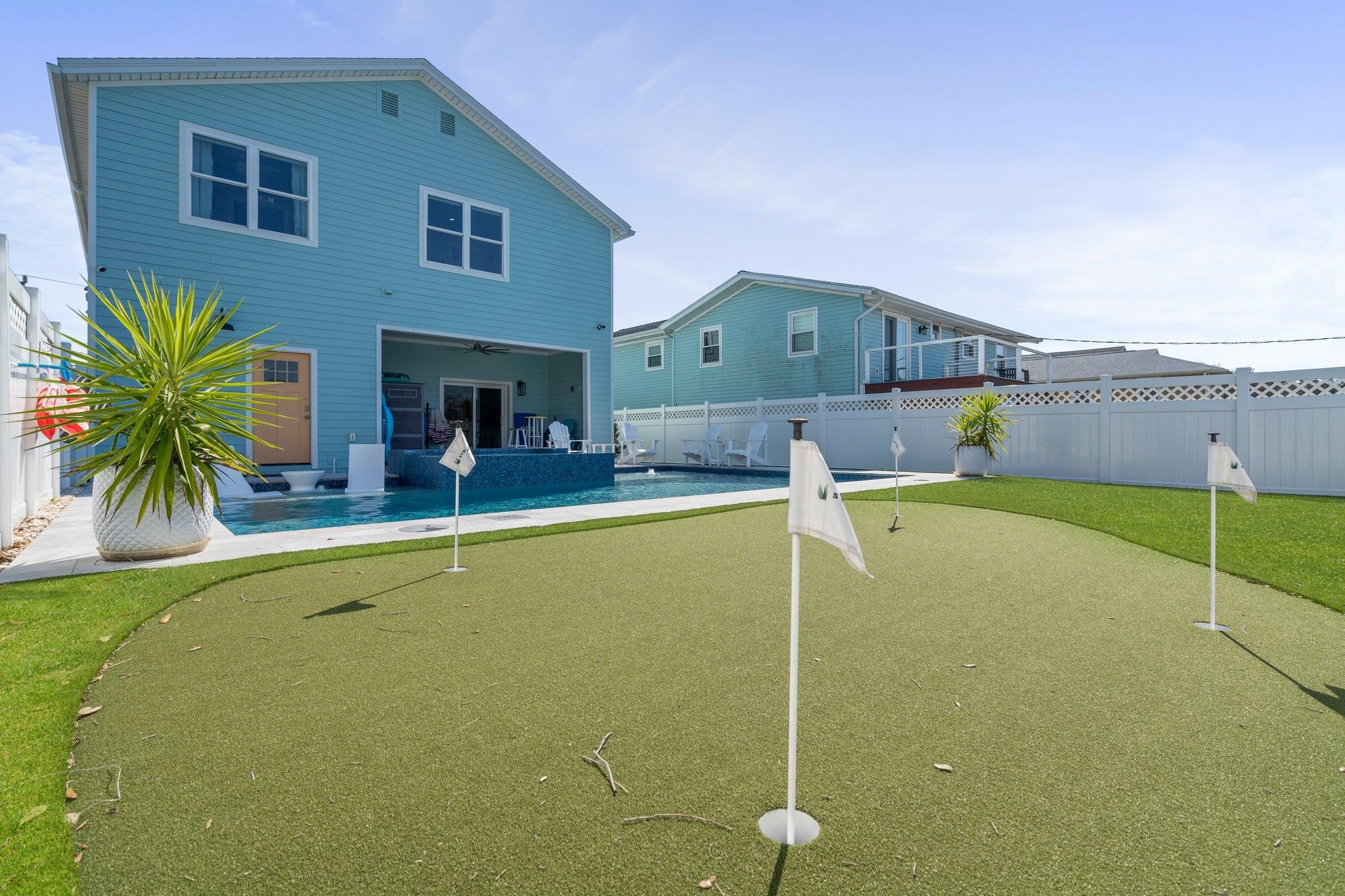 5497 Pelican Way St. Augustine, FL 32080 - Photo 46 of 49 a view of a house with a swimming pool