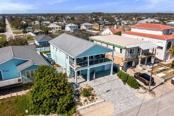 an aerial view of residential building with beach