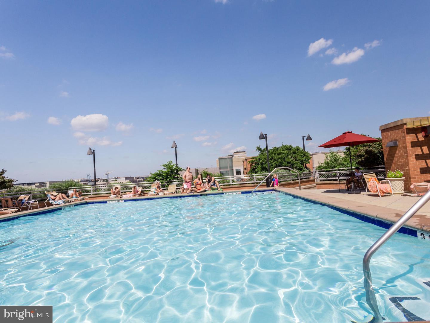 631 D Street Northwest, Unit 1038 Washington, DC 20004 - Photo 21 of 56 a swimming pool view with a sitting space