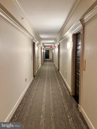 a view of hallway with wooden floor