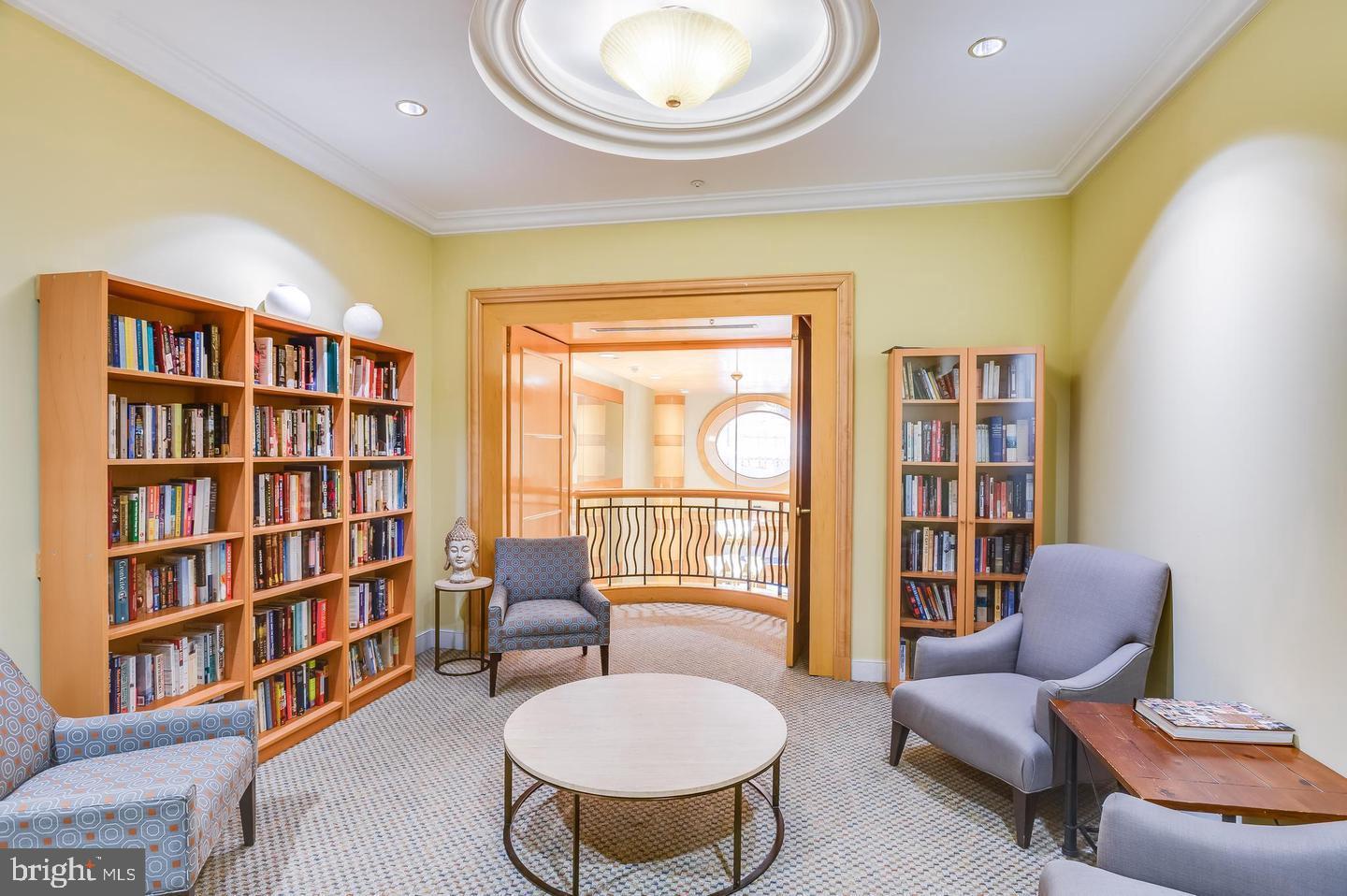 631 D Street Northwest, Unit 1038 Washington, DC 20004 - Photo 51 of 56 a living room with furniture and a book shelf