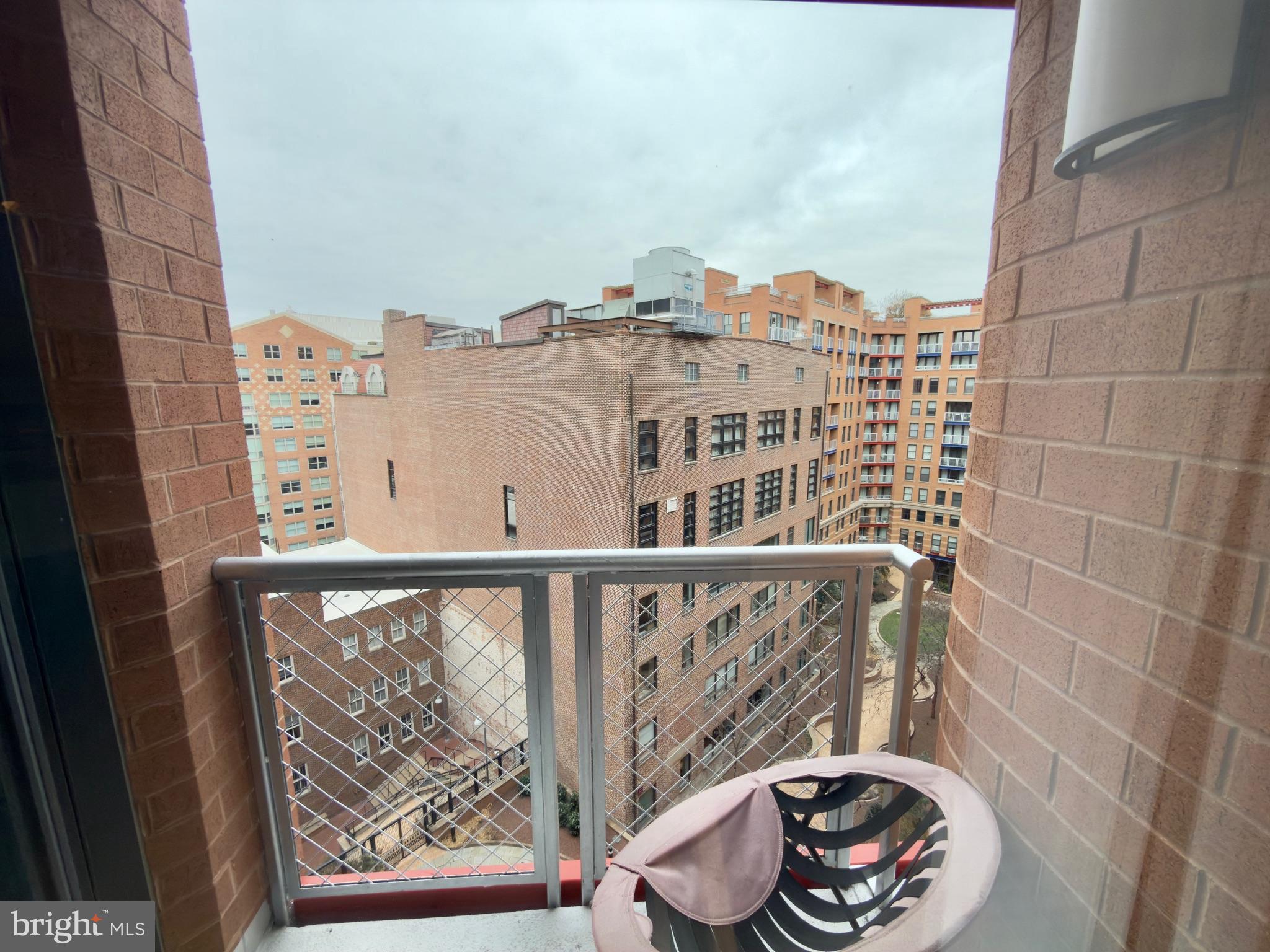 631 D Street Northwest, Unit 1038 Washington, DC 20004 - Photo 8 of 56 a view of a balcony with wooden floor