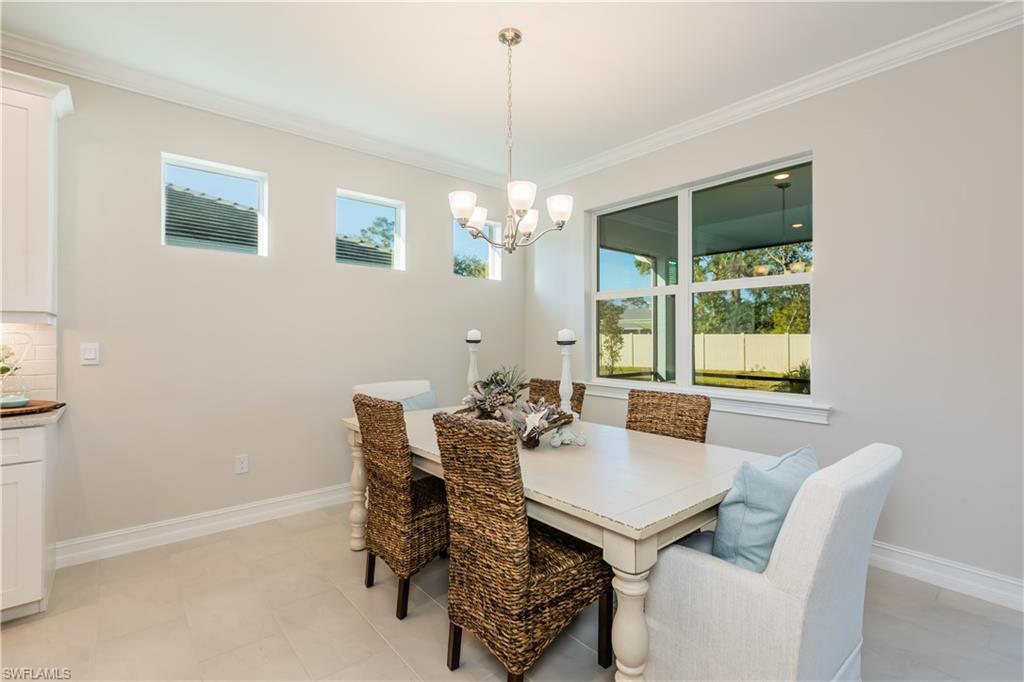 267 Tamarindo Lane Naples, FL 34114 - Photo 13 of 18 a dining room with furniture and window