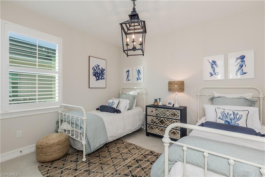 267 Tamarindo Lane Naples, FL 34114 - Photo 17 of 18 a bedroom with a bed and a window