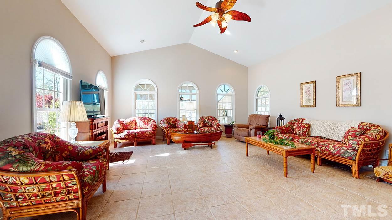 3111 Old Allensville Road Roxboro, NC 27574 - Photo 2 of 17 a living room with furniture a couch and a chandelier