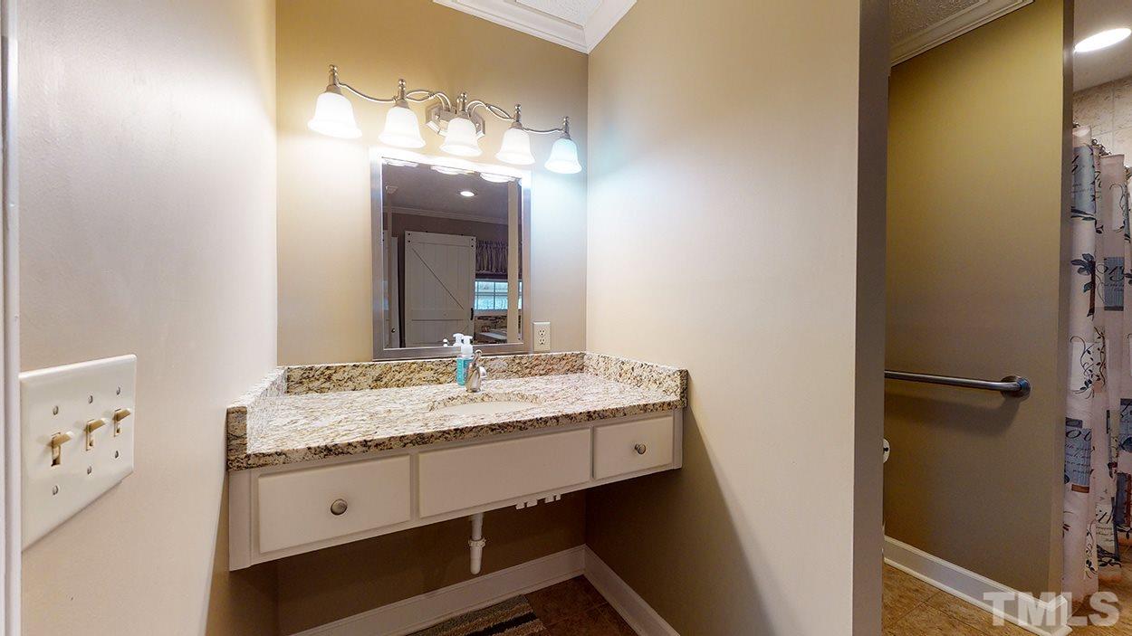 3111 Old Allensville Road Roxboro, NC 27574 - Photo 11 of 17 a bathroom with a granite countertop sink and a mirror