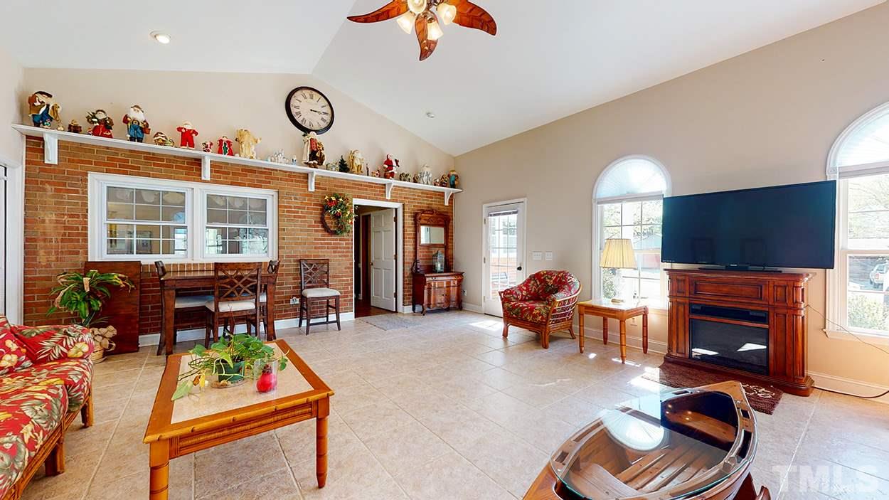 3111 Old Allensville Road Roxboro, NC 27574 - Photo 3 of 17 a living room with furniture and a fireplace