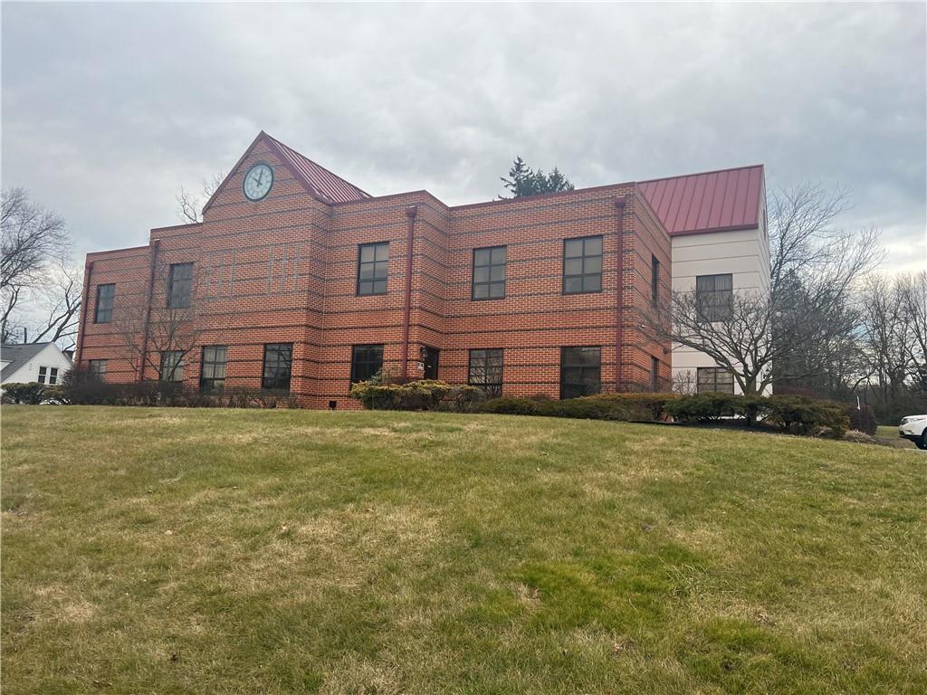2616 Wilmington Road New Castle, PA 16105 - Photo 2 of 15 a front view of a house with a garden