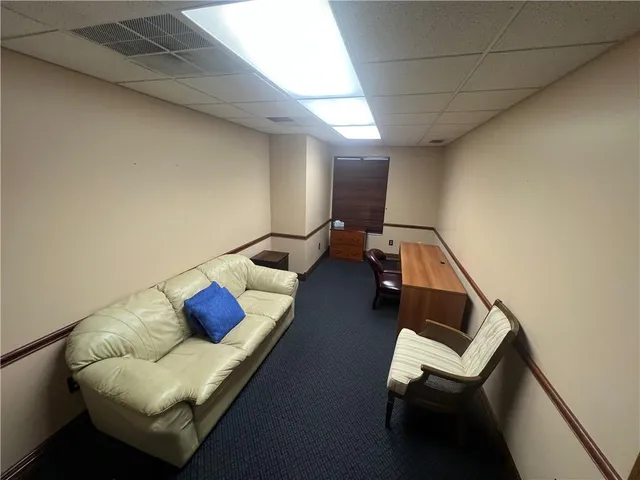 a living room with furniture and a couch