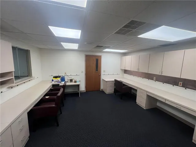 a room with furniture pool table and flat screen tv