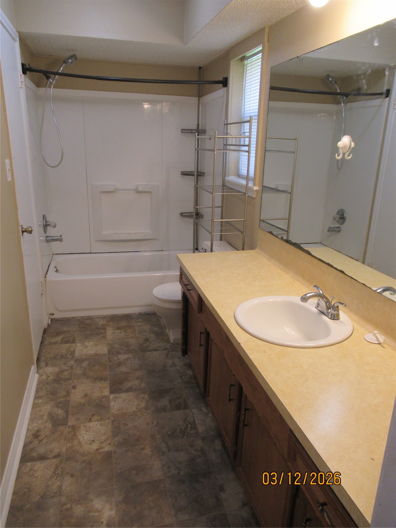 403 Lotus Street Lake Jackson, TX 77566 - Photo 23 of 29 a bathroom with a sink a toilet and shower