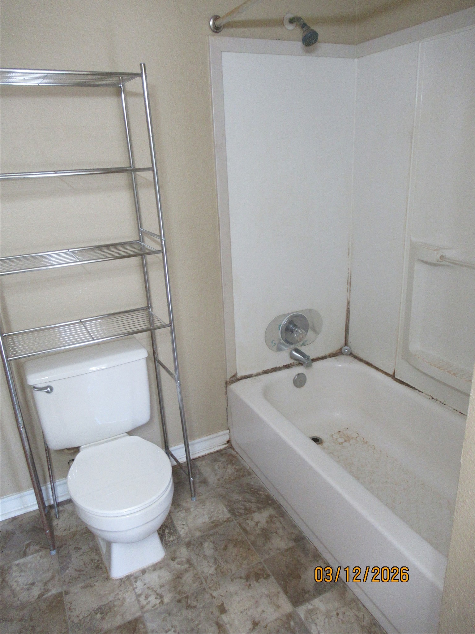 403 Lotus Street Lake Jackson, TX 77566 - Photo 27 of 29 a white toilet sitting next to a bath tub