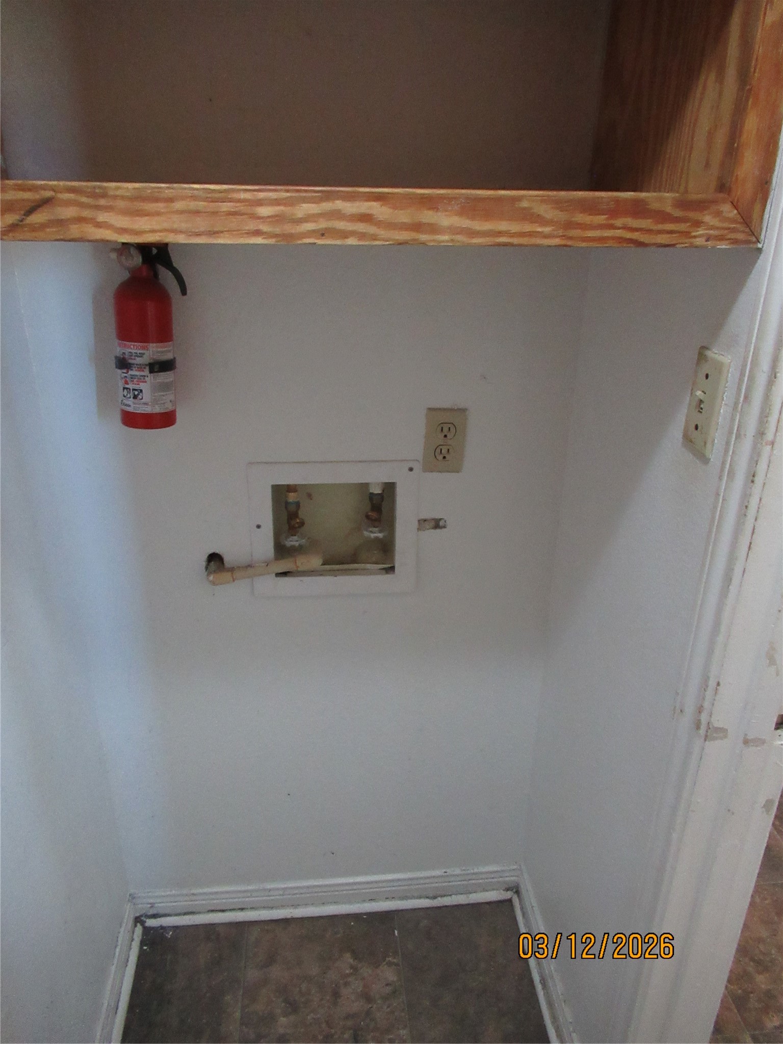 403 Lotus Street Lake Jackson, TX 77566 - Photo 28 of 29 a view of storage and utility room with a small washer and dryer