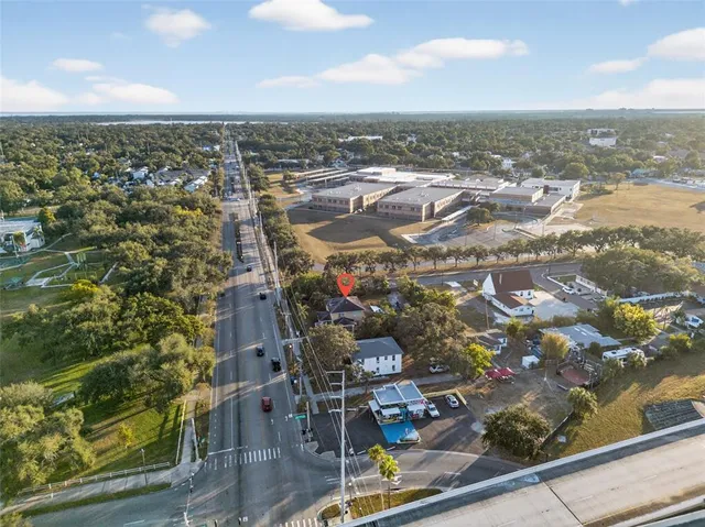 a view of a yard with a tree