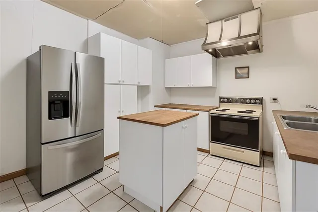 a kitchen with cabinets a stainless steel appliances and counter space