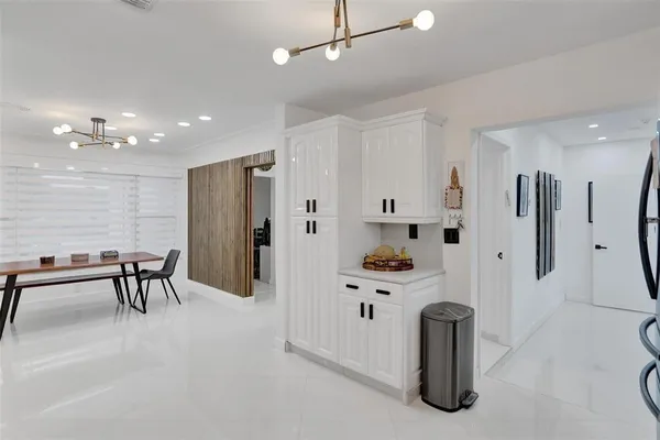 a kitchen with stainless steel appliances white cabinets and a stove