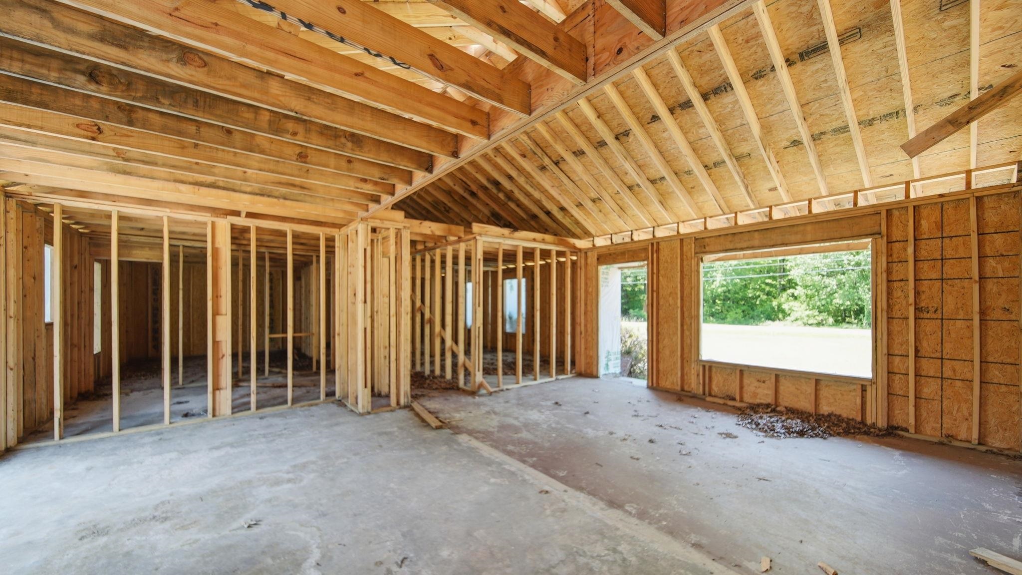 2278 Beaver Road Munford, TN 38058 - Photo 6 of 28 New construction framing featuring exposed wooden trusses and plywood sheathing