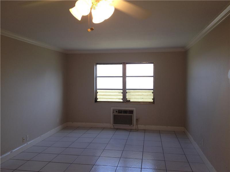 1480 East Sample Road, Unit 105B Pompano Beach, FL 33064 - Photo 1 of 2 Exterior Front
