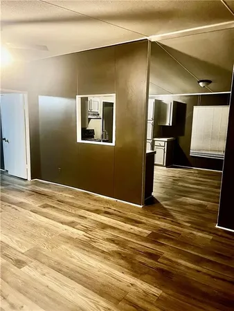 a view of a livingroom with a kitchen