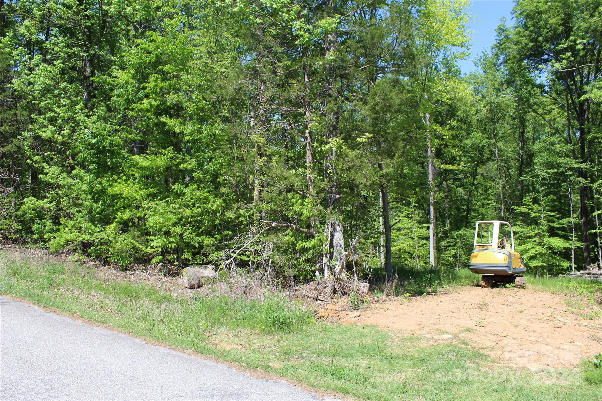 0 Davis Circle Clover, SC 29710 - Photo 13 of 13 a view of a backyard with table and chairs under an umbrella