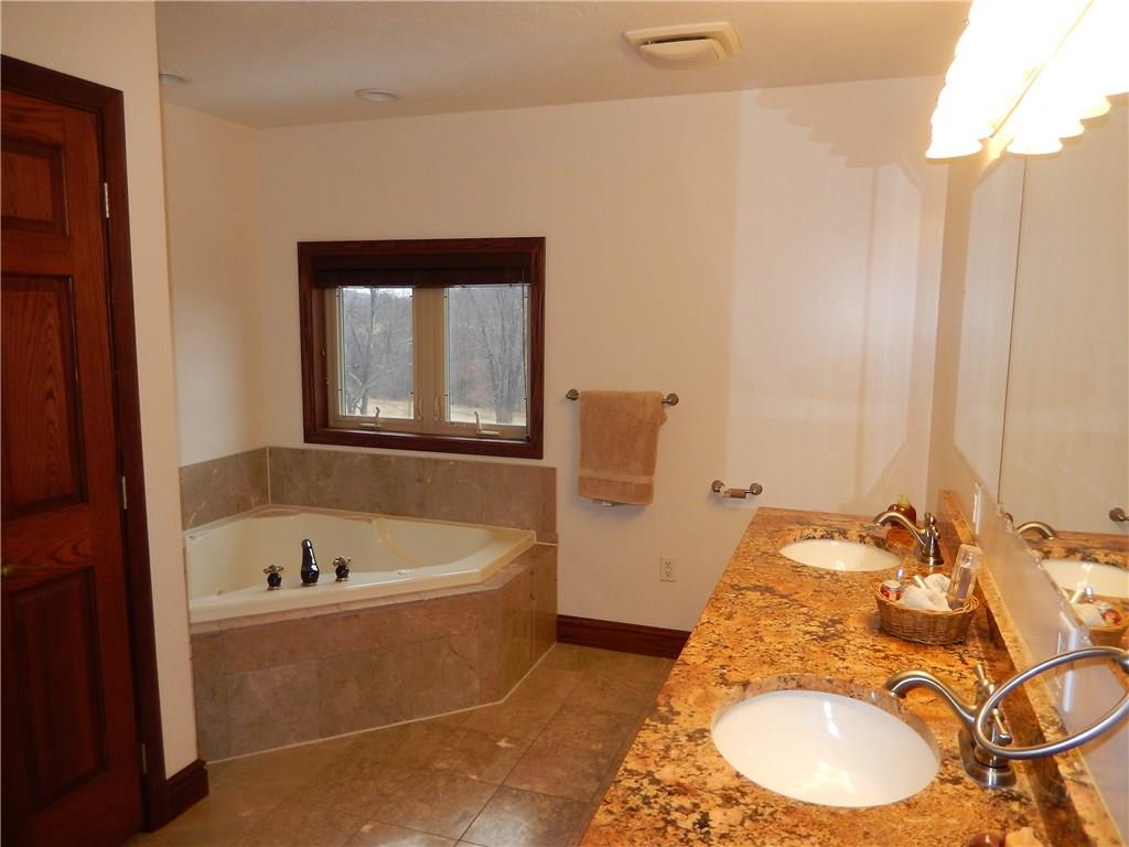 235 Simpson Road Greensburg, PA 15601 - Photo 17 of 21 Luxurious master bath has double sinks and a Jet tub.