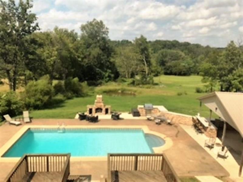 235 Simpson Road Greensburg, PA 15601 - Photo 21 of 21 The wrap around over looked the in-ground pool ,wet bar, stone fireplace, and pavilion style outdoor kitchen.