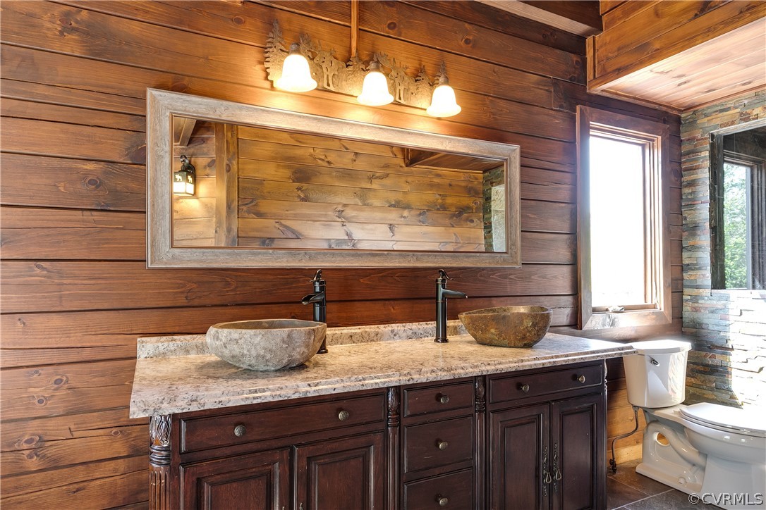 1471 New Bethel Road Meherrin, VA 23954 - Photo 26 of 50 a bathroom with a granite countertop sink and a window