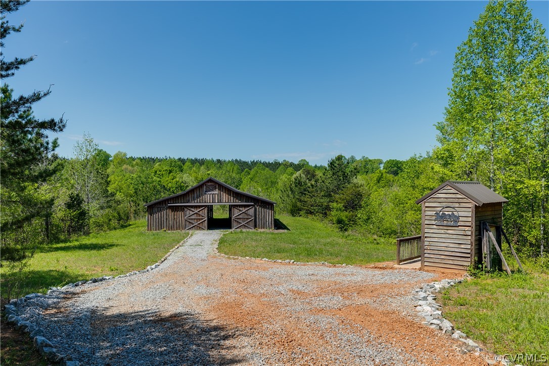 1471 New Bethel Road Meherrin, VA 23954 - Photo 48 of 50 a view of a house with a yard and potted plants