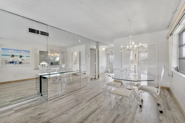 a kitchen with a sink a stove a refrigerator and cabinets