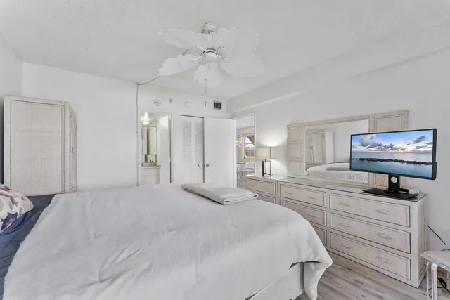 a view of a chairs and table in the balcony