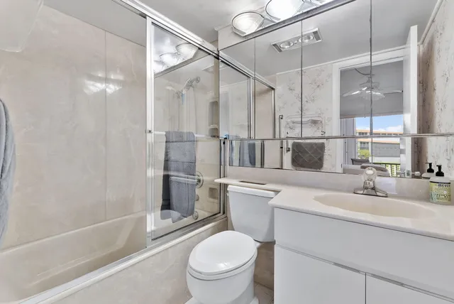 a bedroom with a large bed and a large window