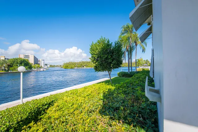 a view of yard with swimming pool and green space