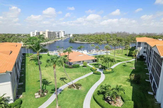 a view of swimming pool with outdoor seating and city view